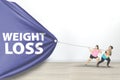 Overweight women drag Weight Loss text Royalty Free Stock Photo