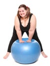 Overweight young woman with blue ball.