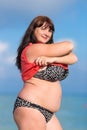 Overweight young woman at the sea Royalty Free Stock Photo