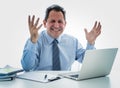 Overwhelmed and desperate mature businessman working with laptop feeling angry and furious at office Royalty Free Stock Photo