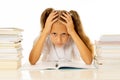 Overwhelmed little girl with a negative attitude towards studies and school after studying too much and having too many homework Royalty Free Stock Photo