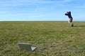 Overwhelmed man running in field away from laptop Royalty Free Stock Photo