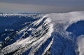 Overwhelmed snow rocky ridge