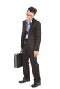 Overwork and exhausted businessman holding briefcase