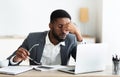 Overworked african american employee after hard day in office Royalty Free Stock Photo