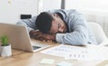 Overworked african american employee sleeping at workplace in office Royalty Free Stock Photo