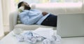 Overworked African business man sleeping on sofa