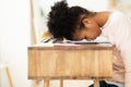 Overworked African Girl Resting Head On Desk Sitting Indoor Royalty Free Stock Photo