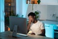 Overworked african man freelancer feeling eye strain and fatigue during prolonged computer use Royalty Free Stock Photo