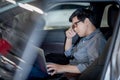 Asian businessman feeling stressed in the car Royalty Free Stock Photo