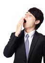 Overworked business man yawning Royalty Free Stock Photo