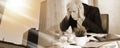 Overworked businessman sitting at a messy desk; multiple exposure Royalty Free Stock Photo