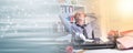 Overworked businessman sitting at a messy desk, light effect  panoramic banner Royalty Free Stock Photo