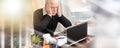 Overworked businessman sitting at a messy desk; multiple exposure Royalty Free Stock Photo