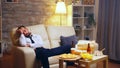 Overworked businessman sleeping on the couch Royalty Free Stock Photo