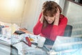 Overworked businesswoman sitting at a messy desk  multiple exposure Royalty Free Stock Photo