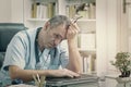 Overworked doctor in his office Royalty Free Stock Photo