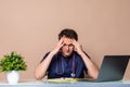 Overworked young doctor sitting in his office Royalty Free Stock Photo