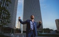 Overworked excited businessman. Hard business at work office outdoor.