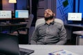 Overworked exhausted man sleeps on chair