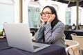 Overworked freelancer woman in stress works at laptop