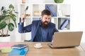 Overworked man crush laptop with hammer. frustrated computer user. businessman express anger. ready to smash. Office Royalty Free Stock Photo