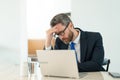 overworked man manager has pain and fatigue. photo of man manager has pain and fatigue. Royalty Free Stock Photo