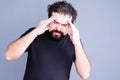 Overworked man rubbing his forehead Royalty Free Stock Photo