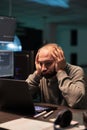 Overworked programmer working on app developing Royalty Free Stock Photo