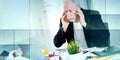 Overworked businessman sitting at a messy desk, geometric pattern Royalty Free Stock Photo