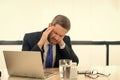 overworked stressed business man has headache pain. photo of stressed business man has headache Royalty Free Stock Photo