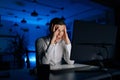 Overworked stressed young man working office at night on computer. Excited tired worker male angry and mad screaming Royalty Free Stock Photo