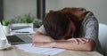 Overworked student girl sleeping at desk feels too tired