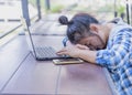 Overworked and tired young business woman sleeping on desk at work in her office Royalty Free Stock Photo