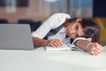 Overworked and tired young woman sleeping on desk at office. Frustrated, business. Royalty Free Stock Photo