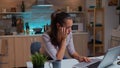 Overworked woman falling asleep working on laptop Royalty Free Stock Photo