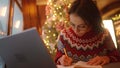 overworked woman freelancer working in xmass decorated coffee shop on Christmas Eve using laptop and notebook. remote