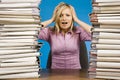 Overworked woman at the office desk Royalty Free Stock Photo