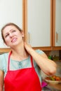 Overworked woman suffering from neck pain. Royalty Free Stock Photo
