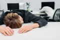 overworked young manager sleeping on work Royalty Free Stock Photo