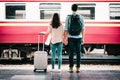 Oving couple tourist holding hand at train station. Royalty Free Stock Photo