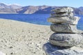 An Ovoo or a sacred pile of rocks at the Pangong lake in Ladakh in the state of Jammu and Kashmir Royalty Free Stock Photo