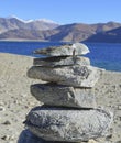 An Ovoo or a sacred pile of rocks at the Pangong lake in Ladakh in the state of Jammu and Kashmir Royalty Free Stock Photo