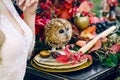 Owl on the festive wedding table with red autumn leaves. Wedding decoration. Artwork Royalty Free Stock Photo