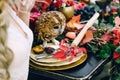 Owl on the festive wedding table with red autumn leaves. Wedding decoration. Artwork Royalty Free Stock Photo