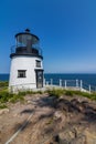 Owls Head Lighthouse on a clear sunny summer day with blue sky