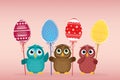 Owls keep Easter decorated eggs on a stick. Multicolored. Vector