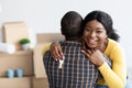 Own House. Happy Black Woman Holding Home Keys And Embracing Husband Royalty Free Stock Photo