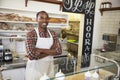 Owner behind the counter of sandwich bar with arms crossed Royalty Free Stock Photo