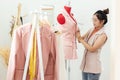 Owner business asian young women fashion designer  working on her designer in the showroom,  Lifestyle Stylish tailor taking measu Royalty Free Stock Photo